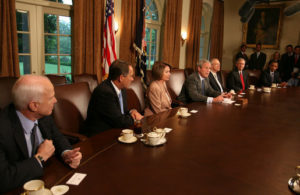 President George W. Bush discusses bailouts with members of Congress in 2008.